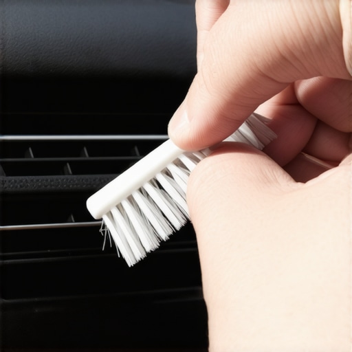 Person cleaning car air vent with a brush, detailed close-up.